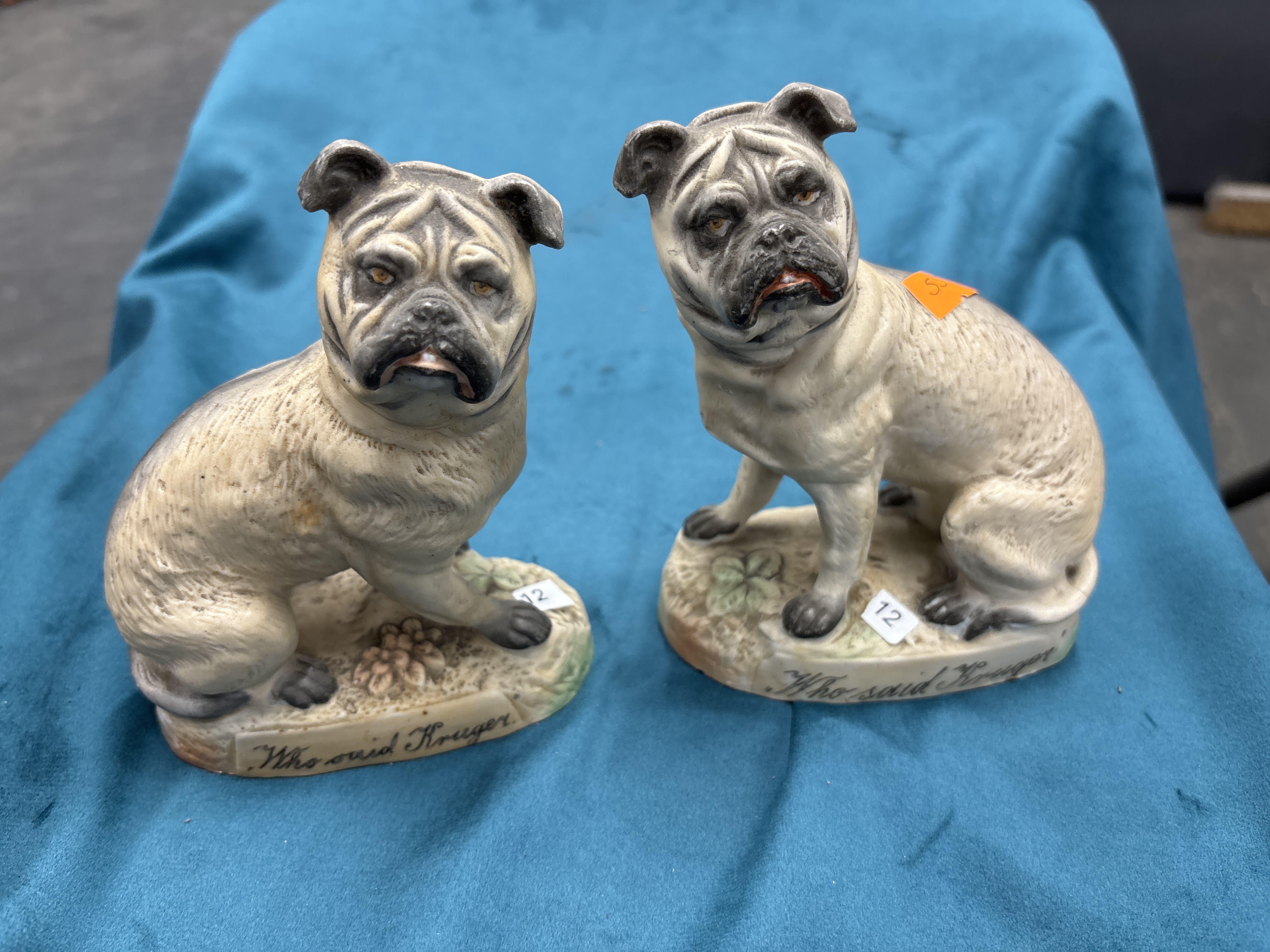 A Pair of Late Victorian Hand-Painted Bisque Porcelain Pug Dog Figurines Who said Kruger