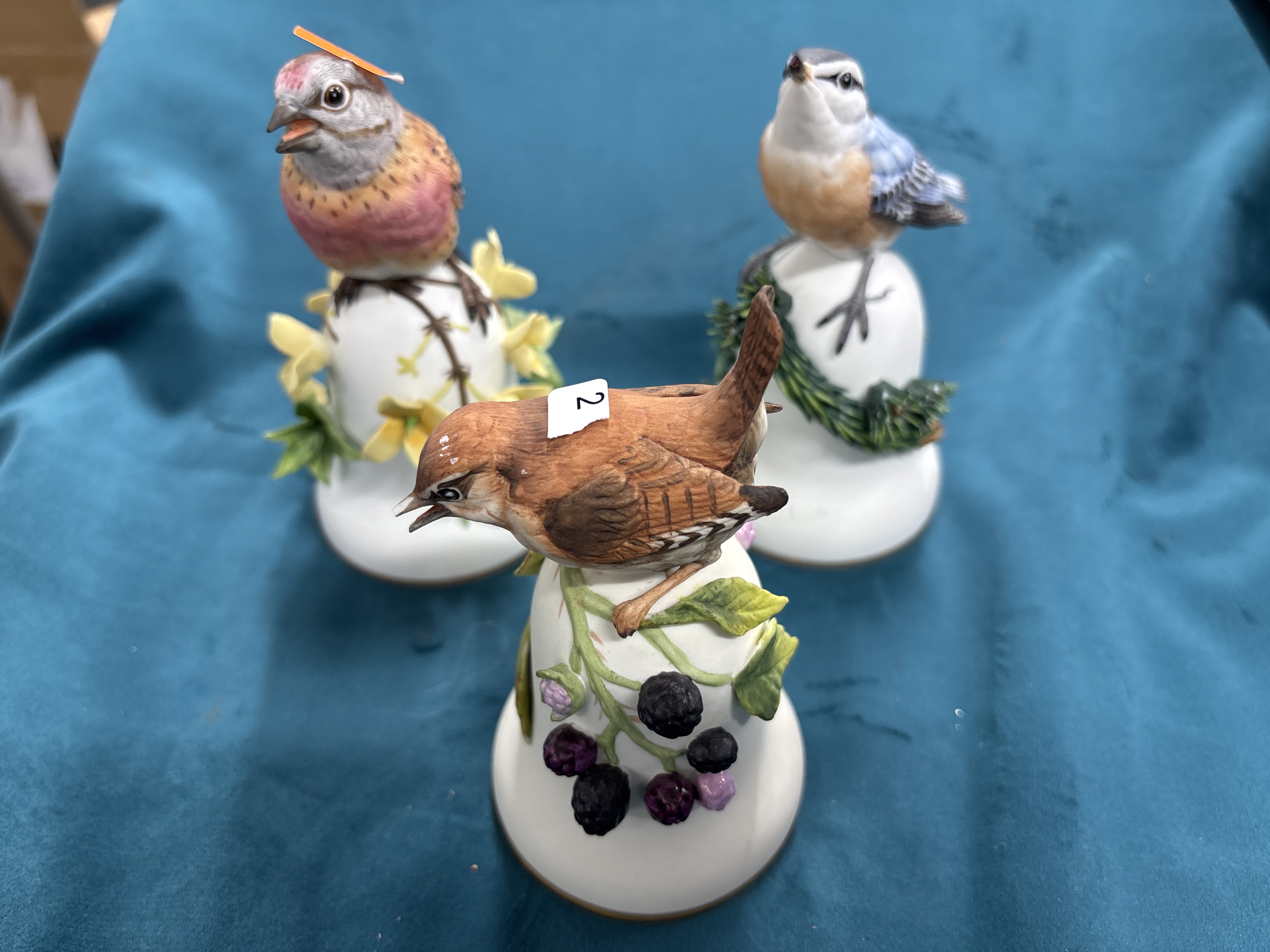 A Trio of Hand-Painted Bisque Porcelain Bird-Form Bells