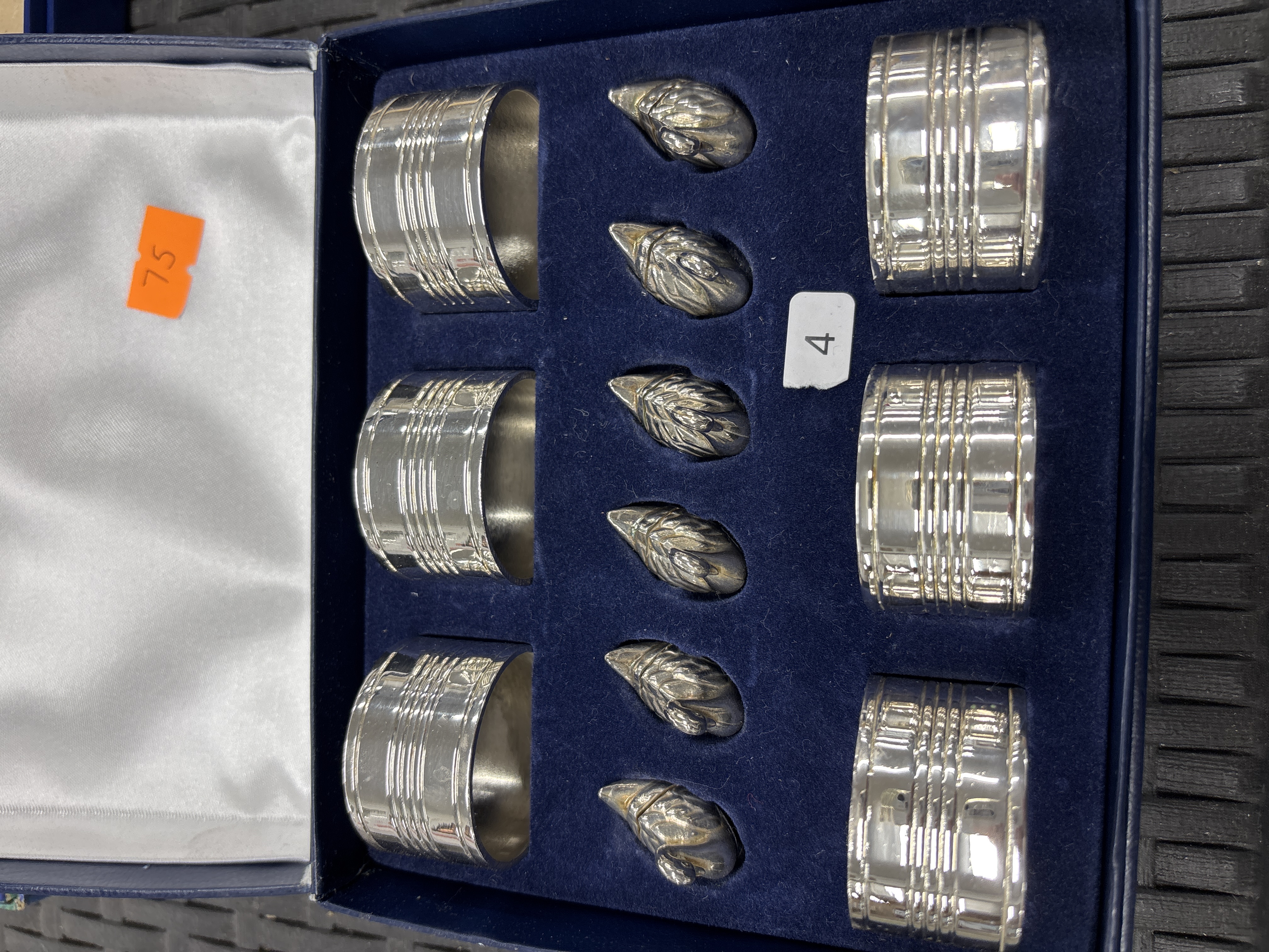 A Set of Silver-Plated Napkin Rings and Swan-Form Place Card Holders in a Fitted Case