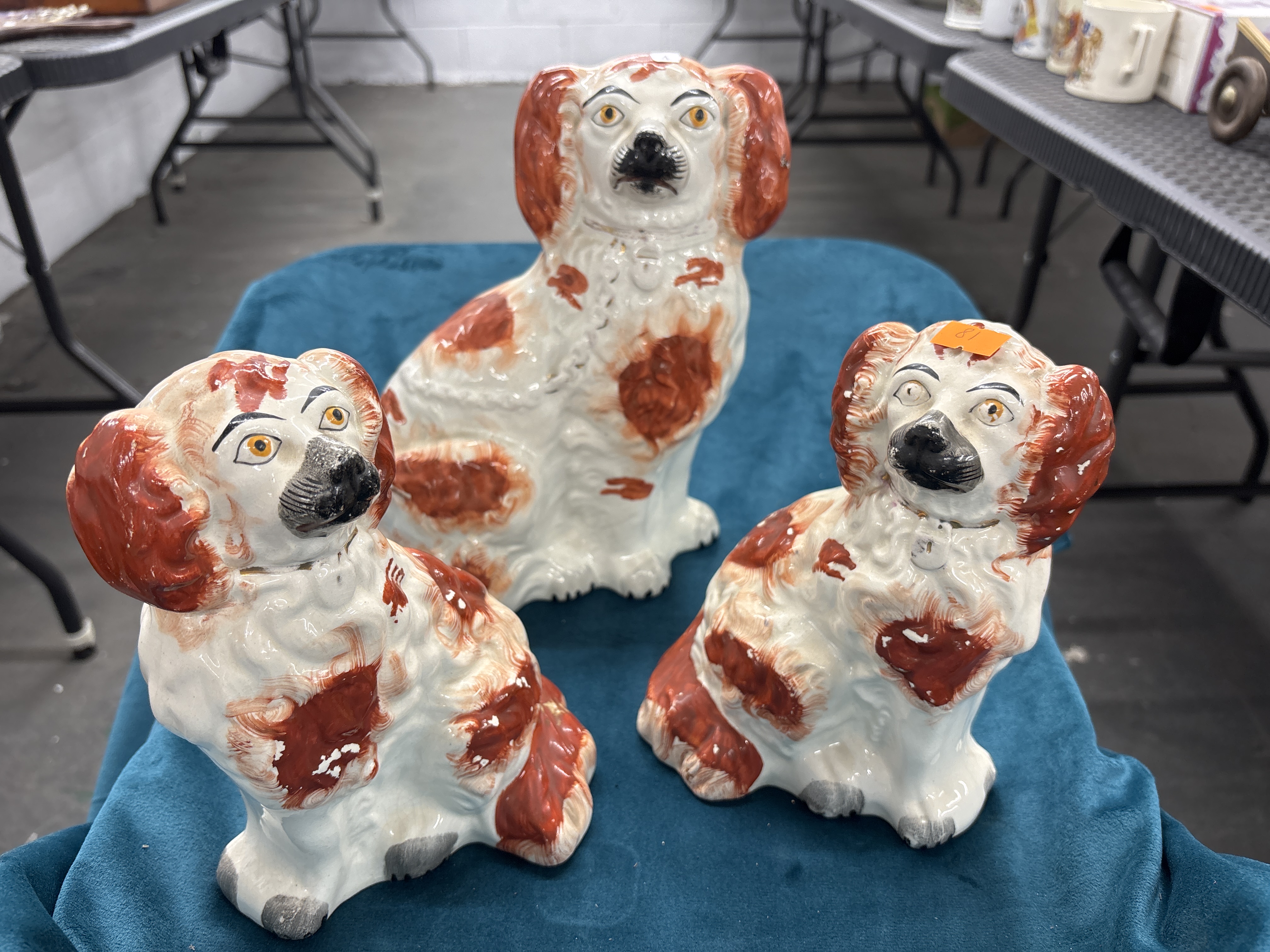 A Trio of Graduated Staffordshire Style Ceramic Seated Spaniel Figurines