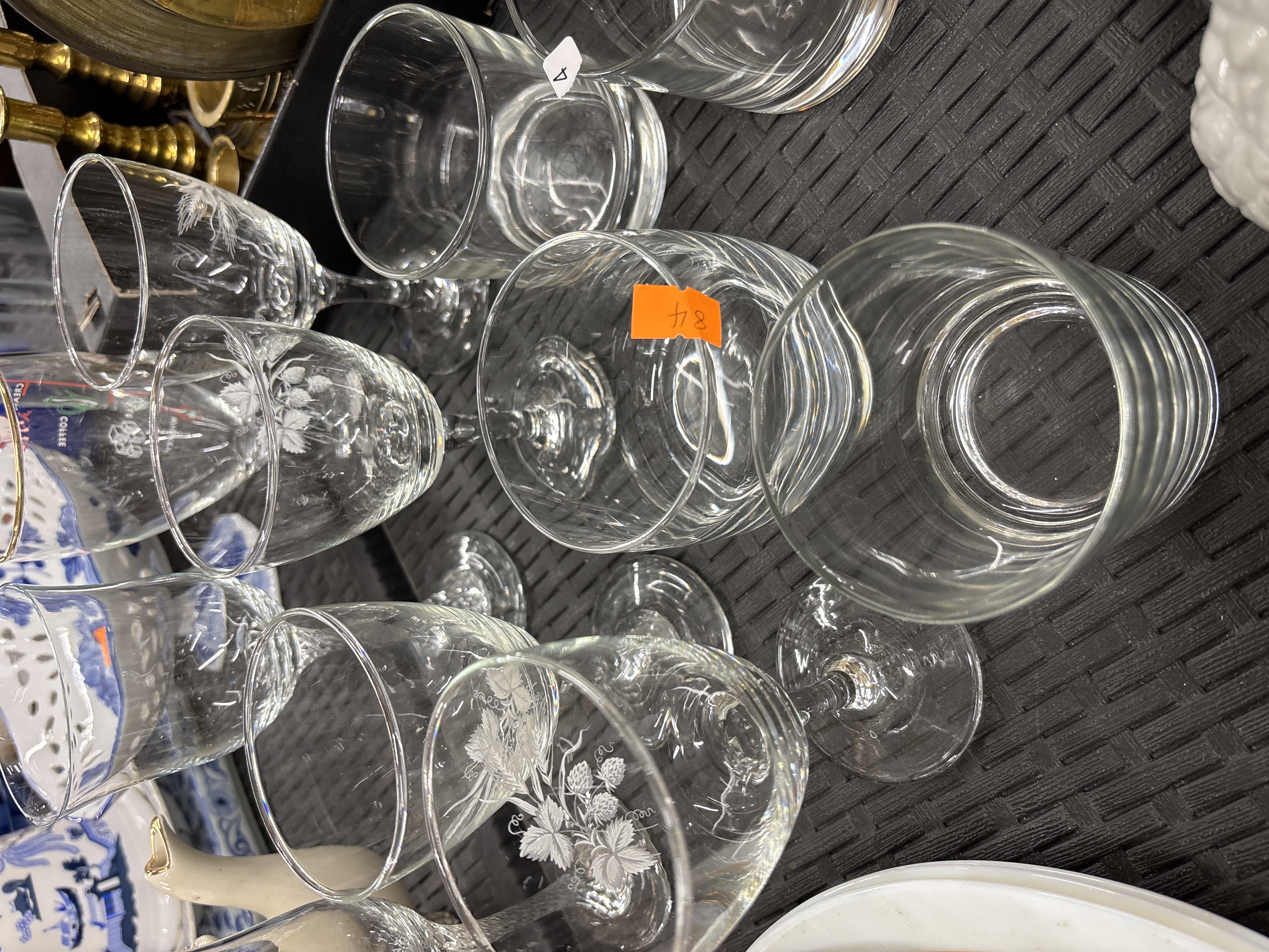 An Assortment of Etched and Plain Stemmed Glassware