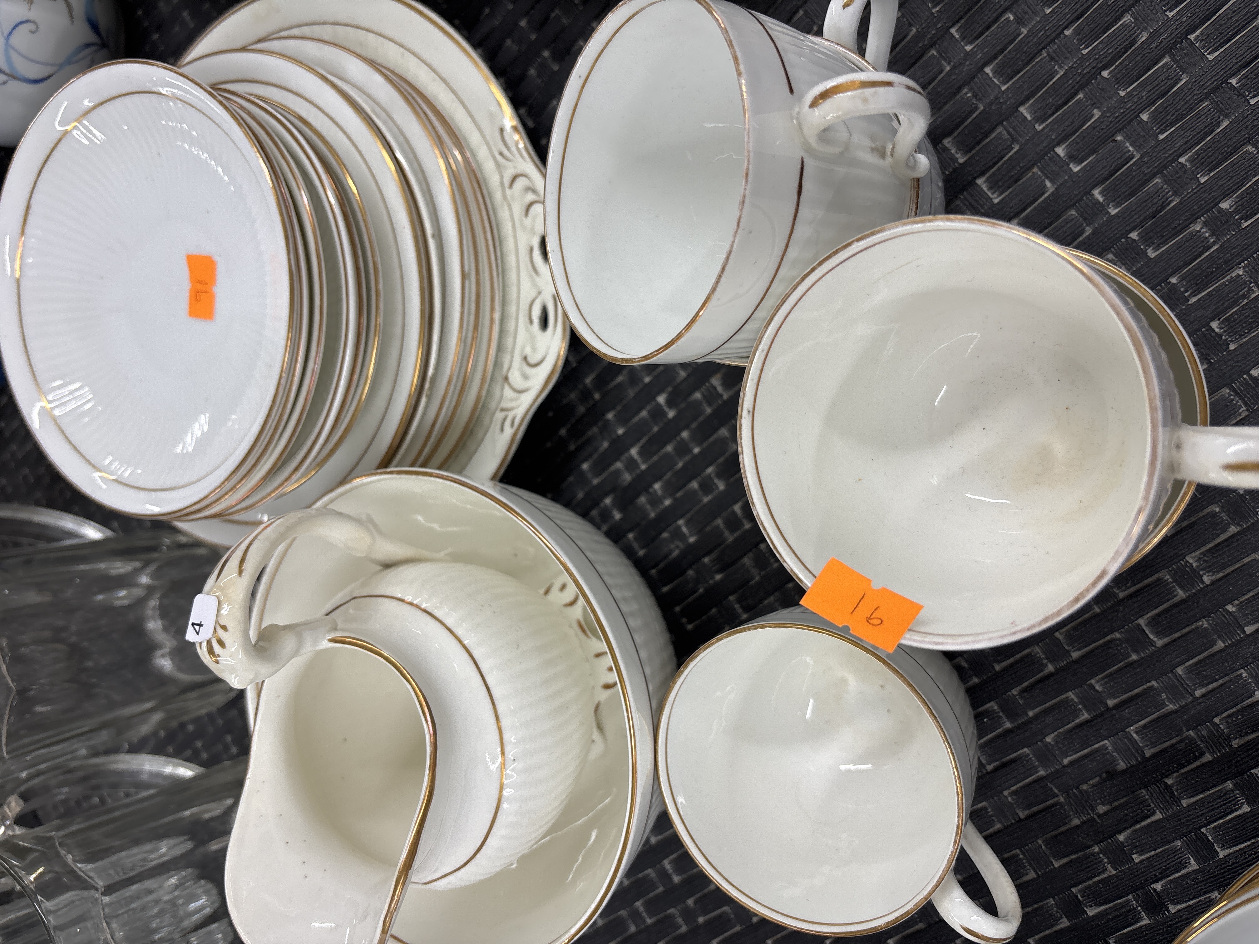A Collection of White Porcelain Tea and Tableware with Gilt Rims