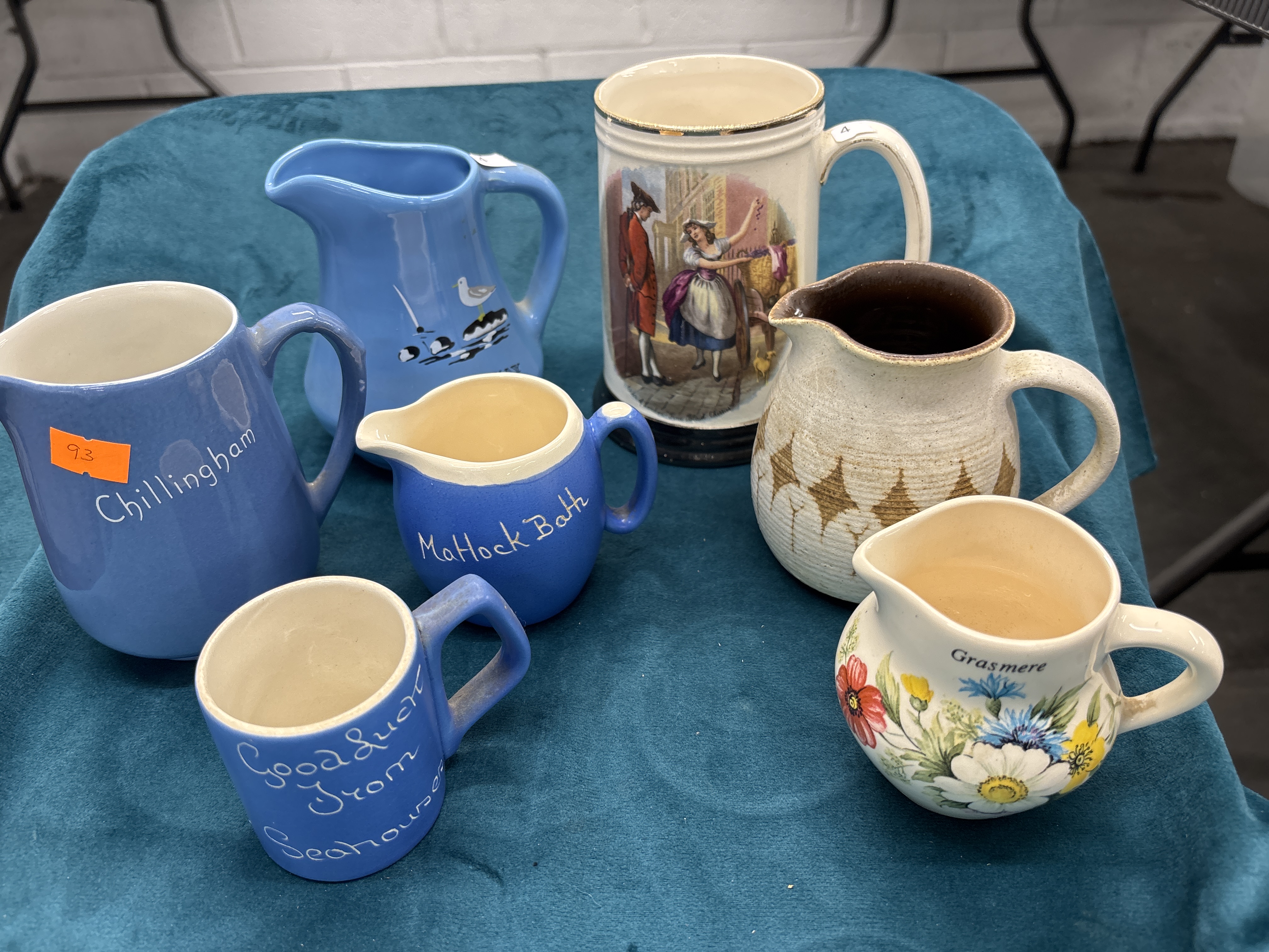 An Assortment of British Souvenir and Decorative Earthenware and Stoneware Jugs and Mugs
