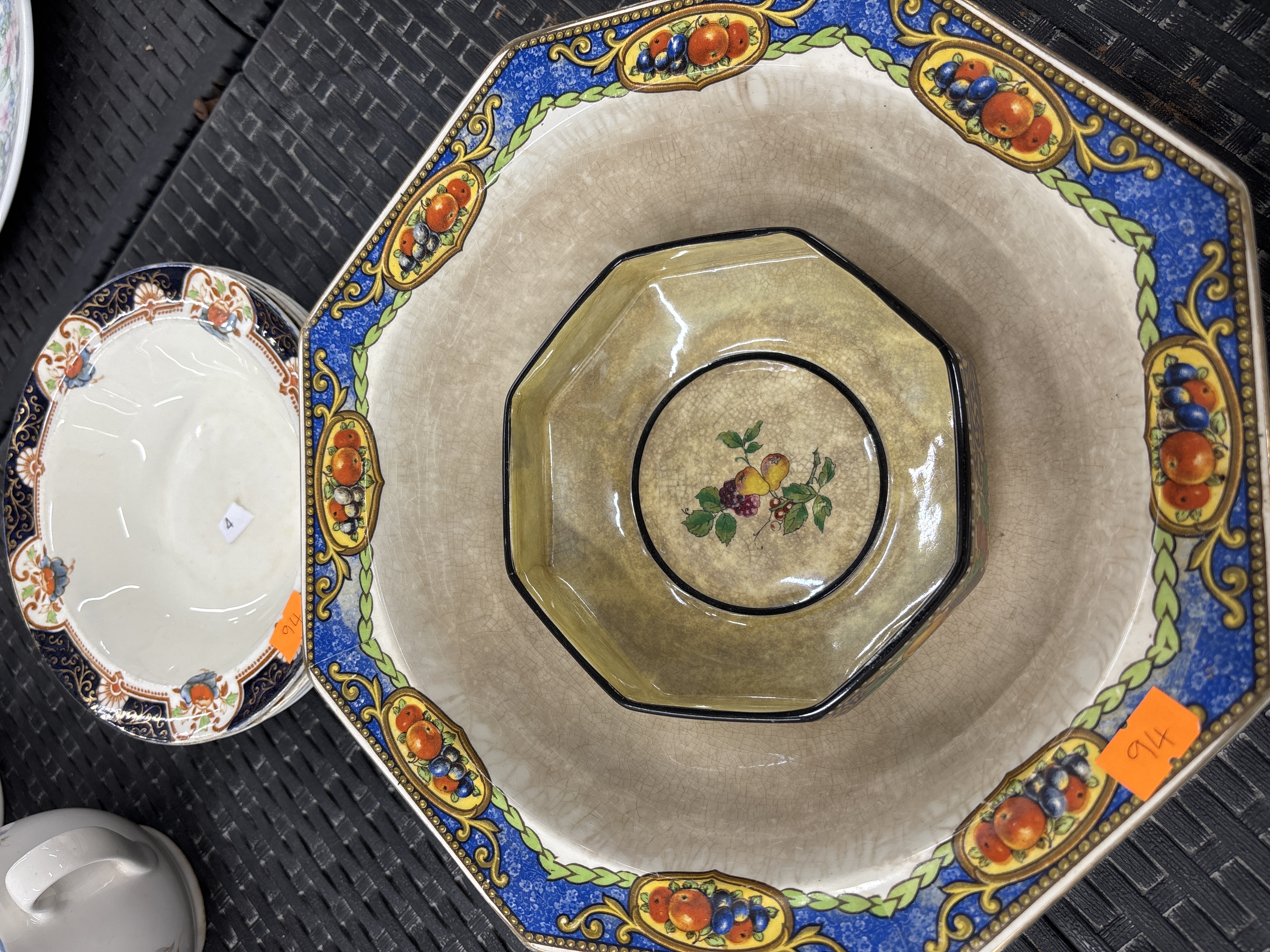 A Collection of Decorative Fruit and Floral Earthenware Bowls and a Basin