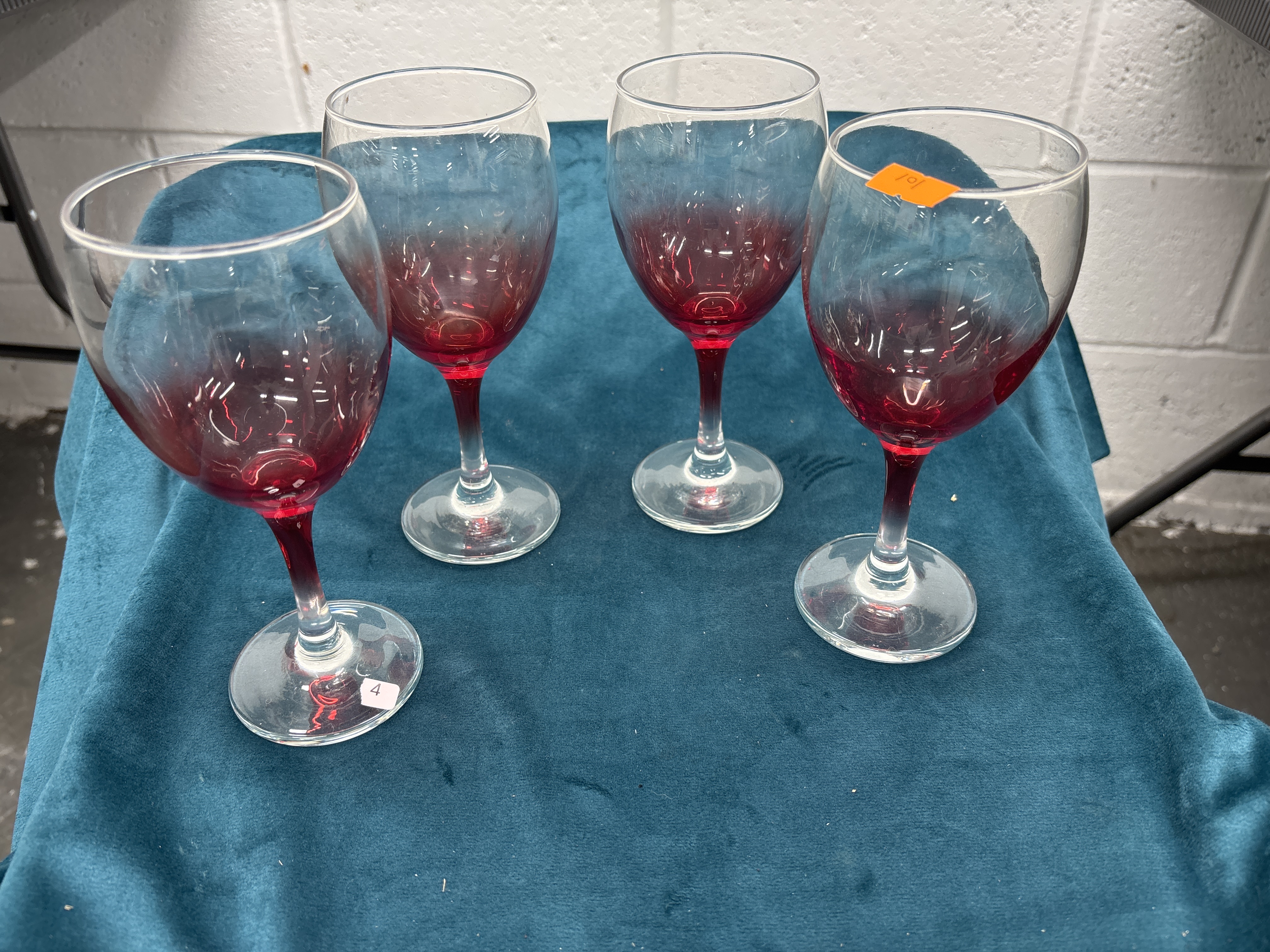 A Set of Four Cranberry Gradient Glass Wine Goblets