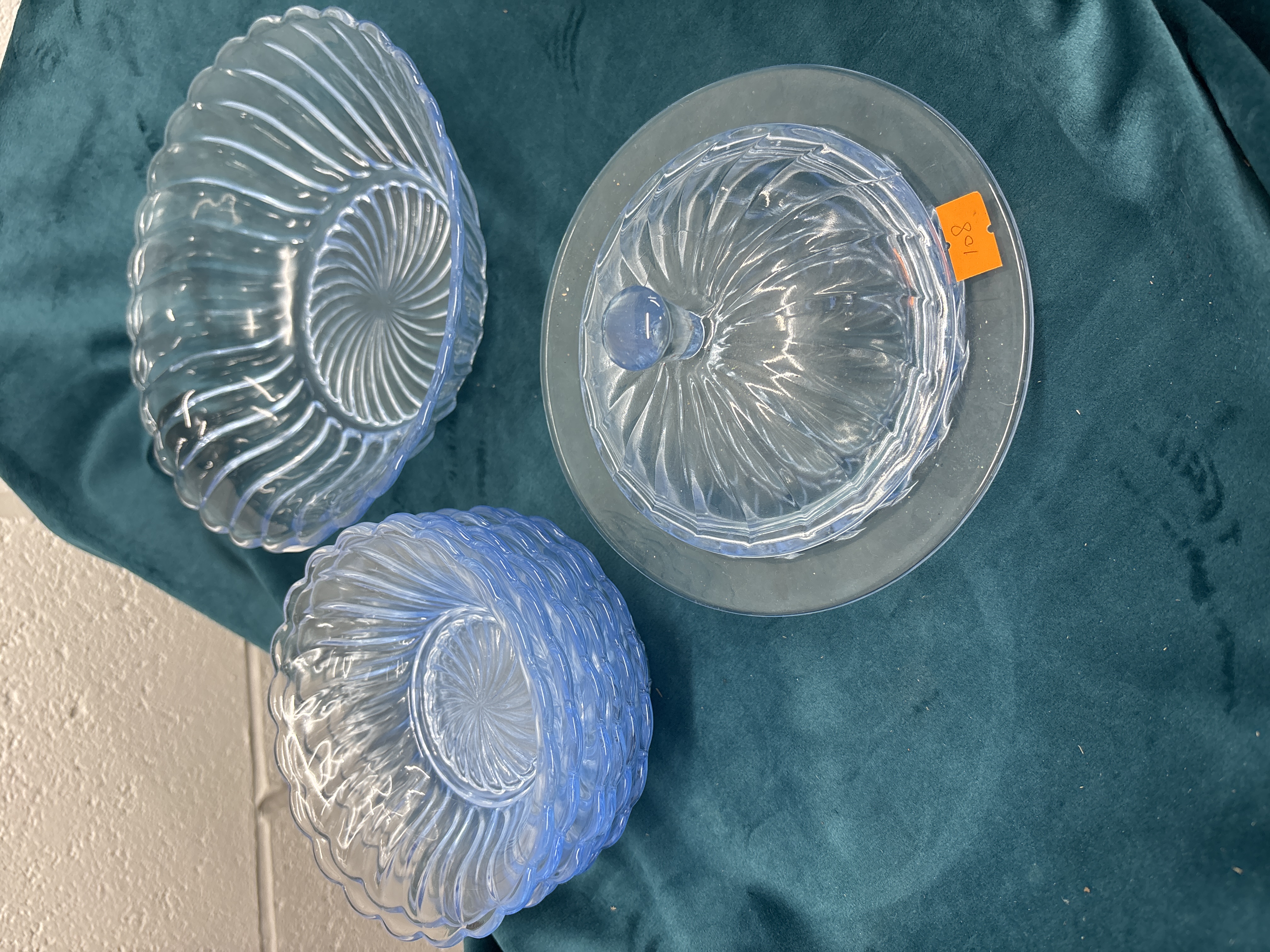 A Trio of Light Blue Pressed Glass Bowls and a Lidded Dish