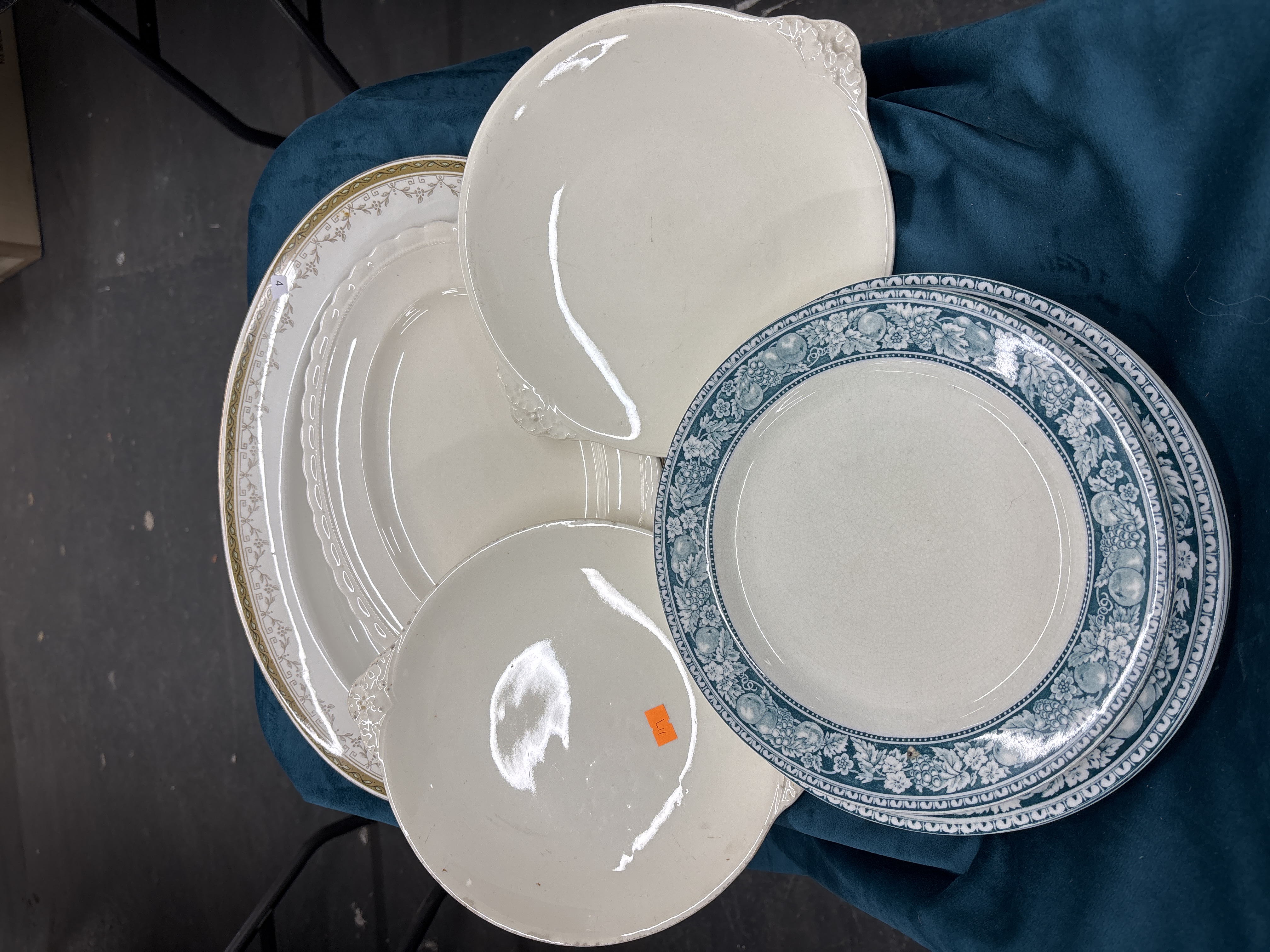 An Assortment of Ceramic Tableware Including an Oval Gilded Platter and Blue Transferware Plates