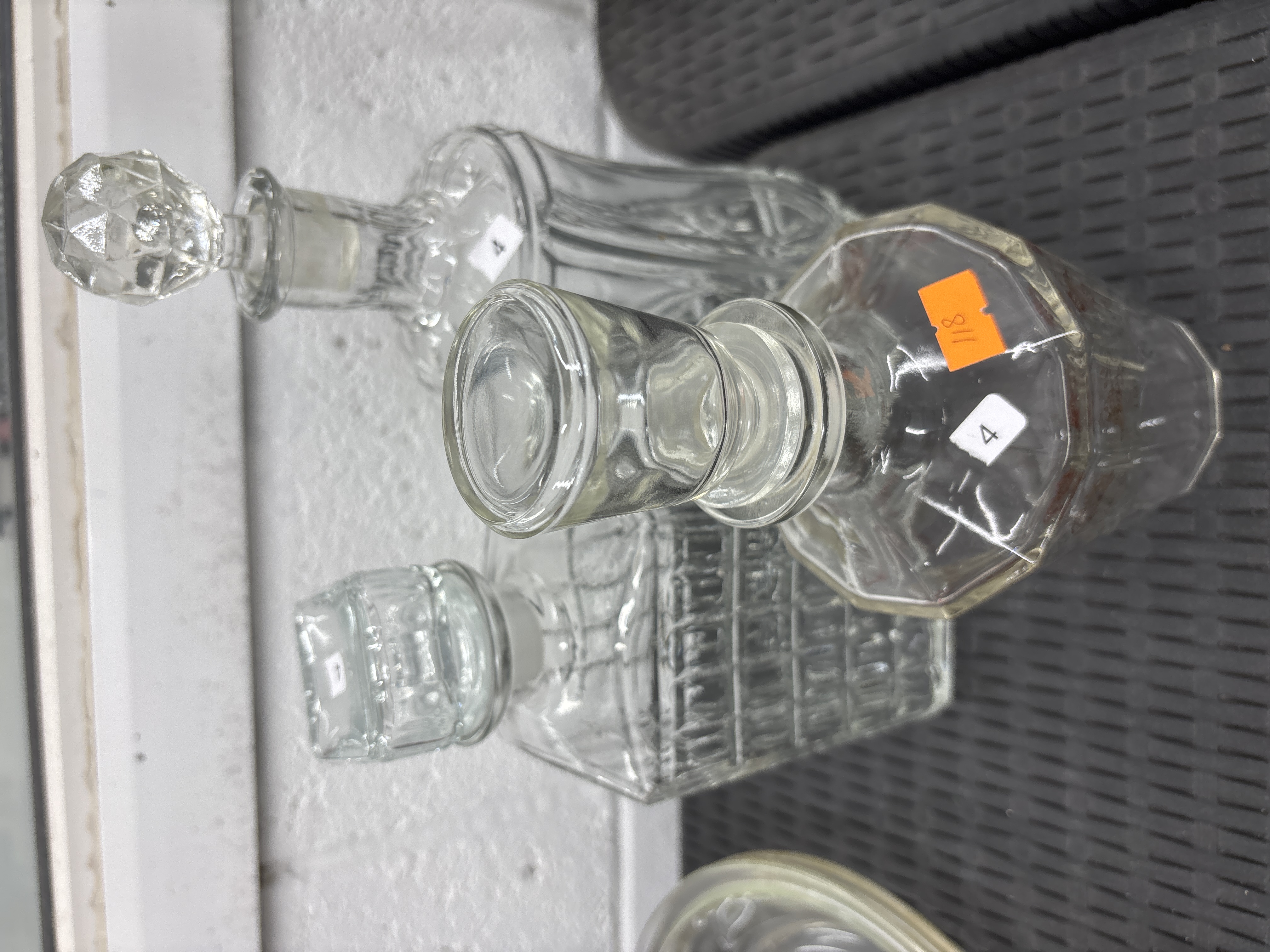 Three glass spirit decanters with stoppers