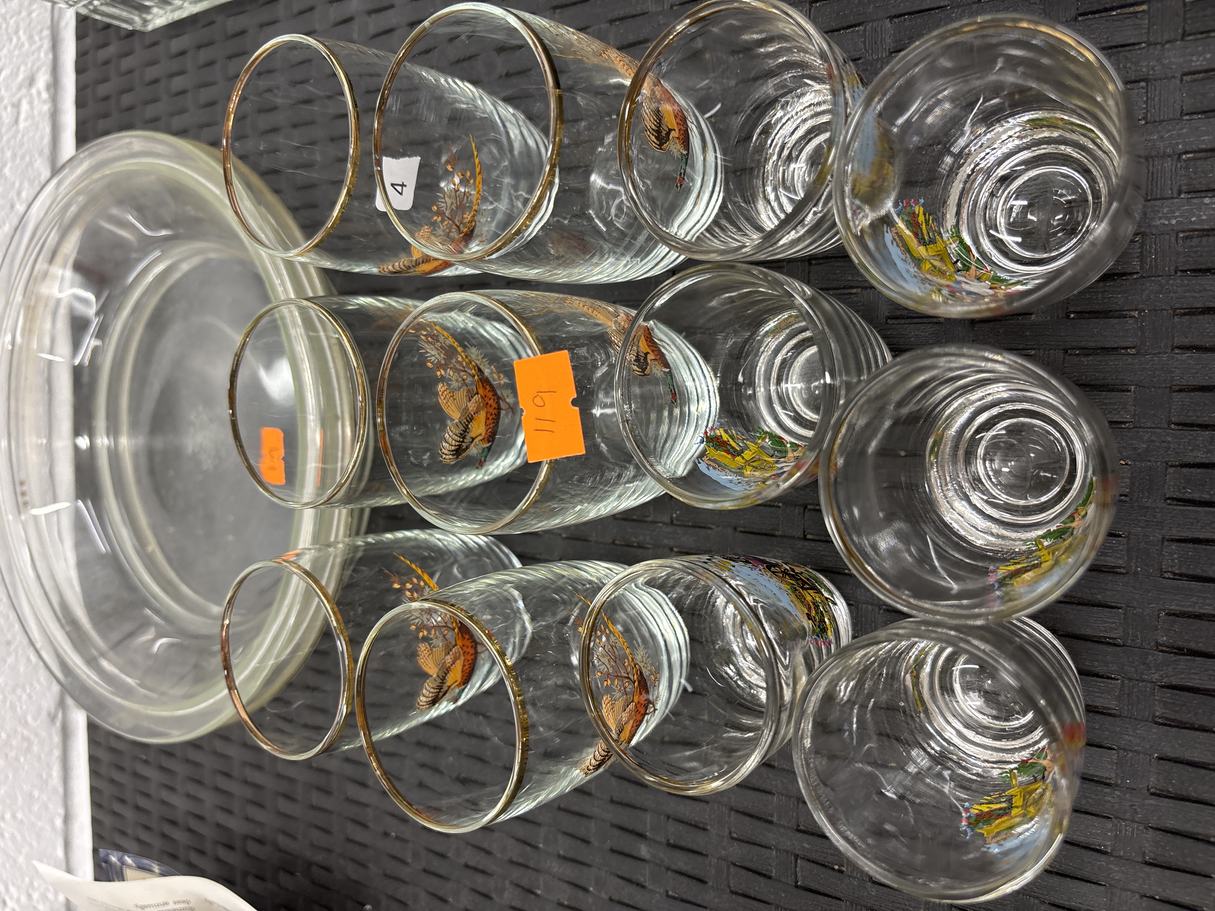 A Set of Twelve Clear Glass Tumblers with Enamelled Sporting Motifs and a Circular Glass Lid