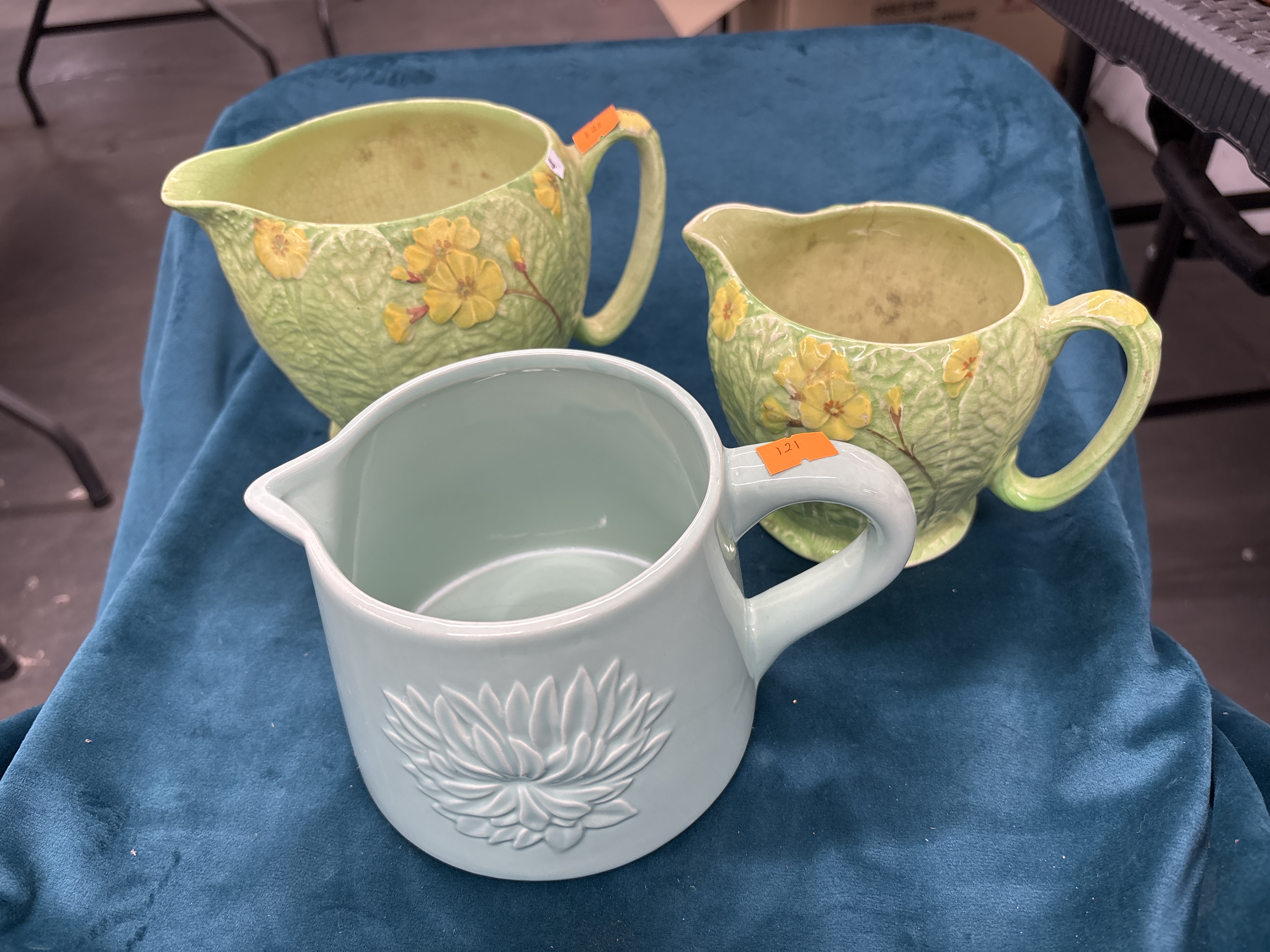 Three Earthenware Floral Motif Pitchers