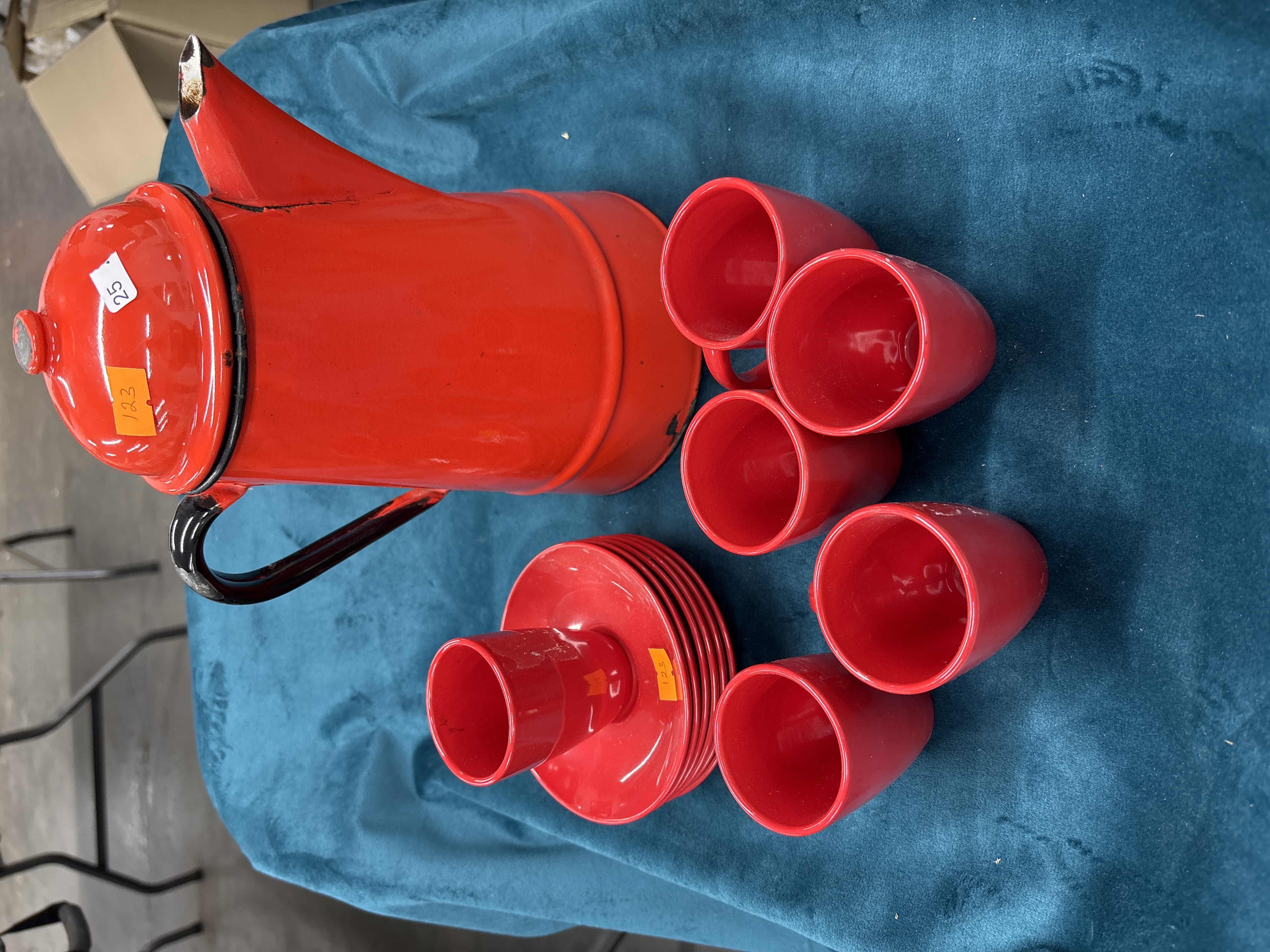 A vintage red enamelled metal coffee service