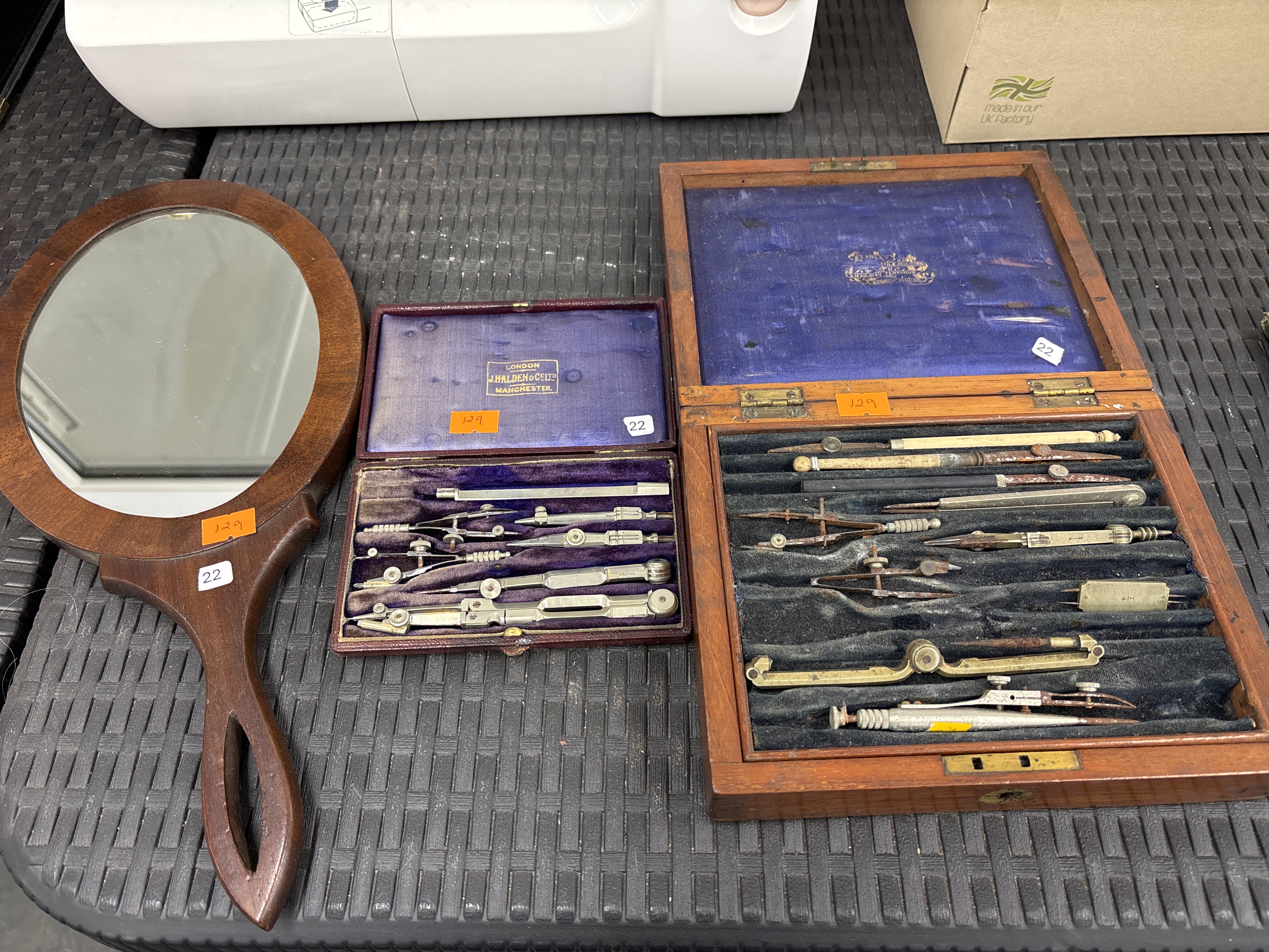 A Trio of Antique Items Comprising Two Cased Sets of Drawing Instruments and a Wooden Hand Mirror