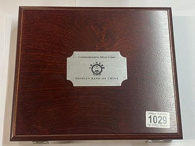 A collection of 15 Peoples Bank of China Silver Coins including 10 Yuan Panda x 2, 10 Yuan