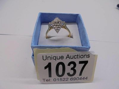 An 18ct yellow gold emerald set ring with 1 carat of diamonds to shank, size O half, 3.5 grams.