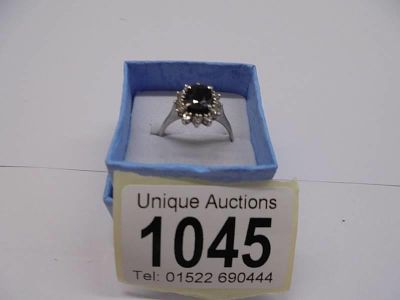 An 18ct diamond and sapphire white gold ring, size P half, 4.27 grams.