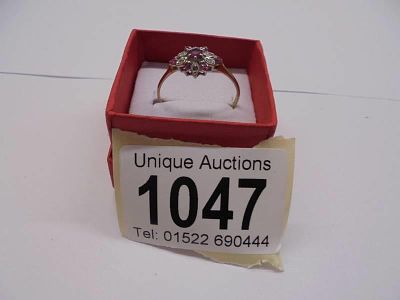 A 9ct yellow gold petal diamond and sapphire ring, size V, 1.5 grams.