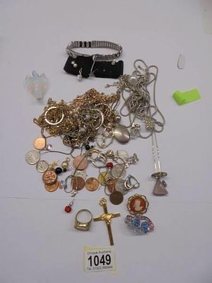 An opaline glass angel pendant and assorted costume jewellery.