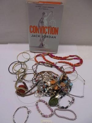 A quantity of costume jewellery and a signed Jack Jordan first edition book.