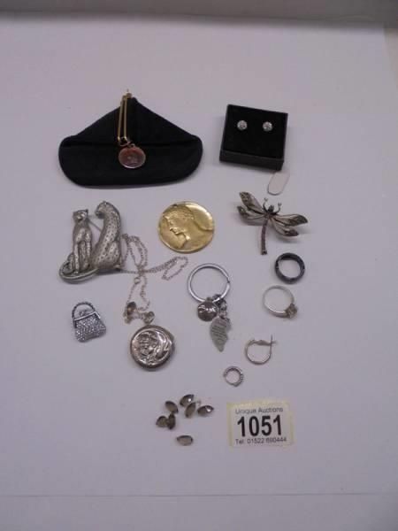A mixed lot of rings, earrings, pendants etc.,