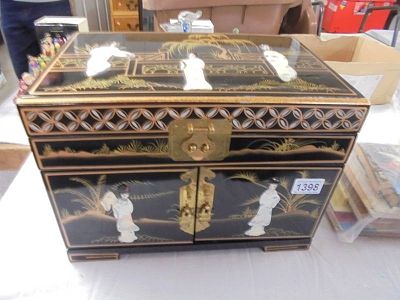 A good quality lacquered jewellery cabinet decorated with mother of pearl figures,.
