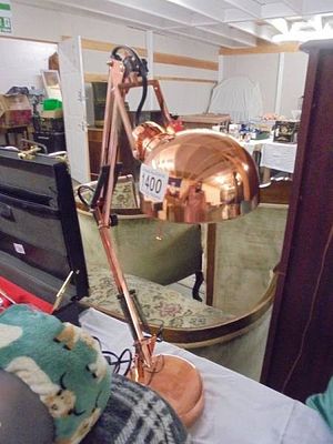 A good quality anglepoise lamp in a copper finish.