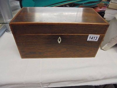 A Georgian inlaid rosewood veneered tea caddy.
