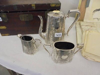 A three piece silver plate tea set.