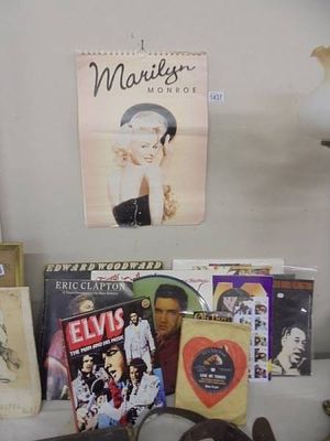 A quantity of Elvis memorabilia inluding picture disc and a 2008 Marilyn Monroe calendar.