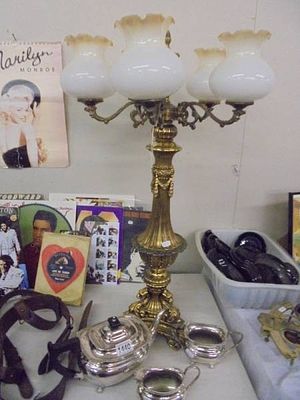 An ornate gilded five light table lamp (needs wiring).