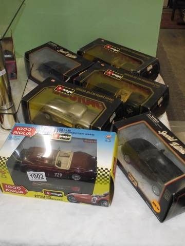Four boxed Burago &amp; two Manlo 1/24 scale Jaguar cars.