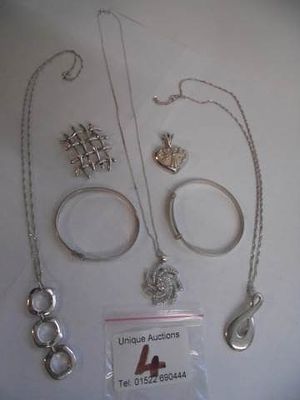 Three silver necklaces, two silver fobs and 2 silver children's bangles, 52 grams.