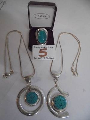 Two good silver pendants and a ring.