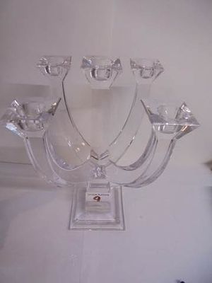 A heavy glass candelabra for five candles., 25 cm tall.