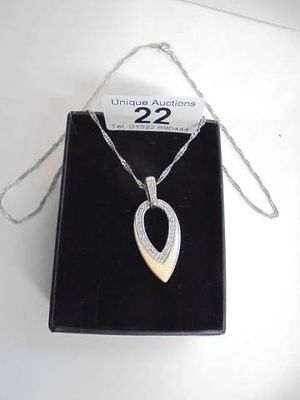 A good quality silver pendant set with small coloured stones.