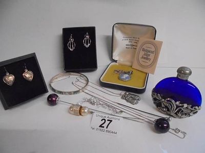 A mixed lot including silver bangle, silver necklace, hat pins, blue glass overlaid with pewter 
