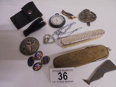 A mixed lot including blue Buddha, cigar holder, enamel cuff links, compass etc.,