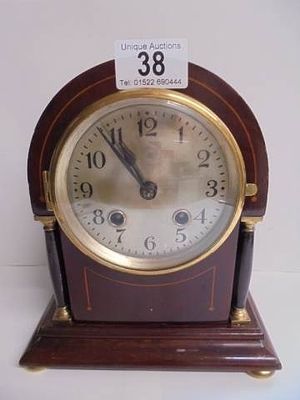 An Edwardian mahogany mantel clock.