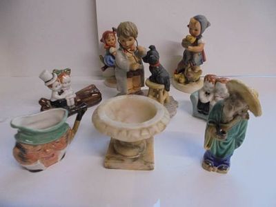 A mixed lot including Goebel figures, small alabaster urn etc.,