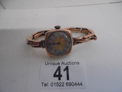 A 9ct gold ladies wristwatch on a 9ct gold bracelet