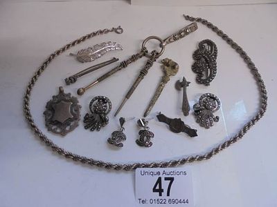 A mixed lot including costume jewellery, silver fobs, silver chain, part chatelaine etc.,