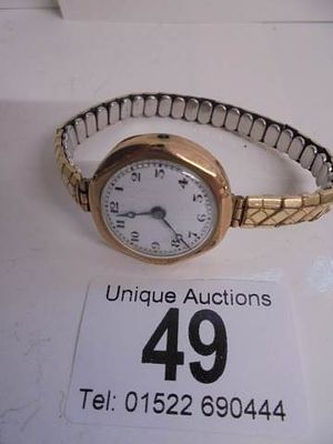 A ladies 9ct gold watch on a metal bracelet, a/f.