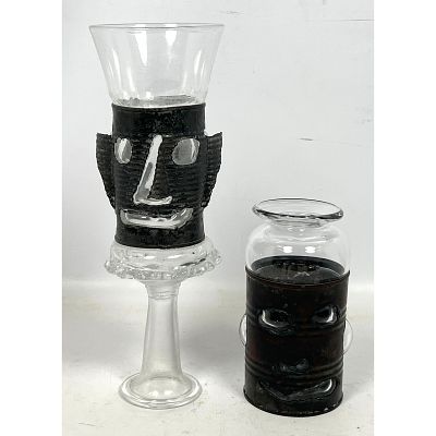 2pc HANK MURTA ADAMS Studio Glass Faces. Clear glass blown into tin cans with torch cut faces