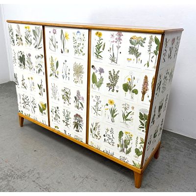 Swedish, Nordens Flora cabinet. Applied offset lithographs on Birch Cabinet. 3 doors with 
