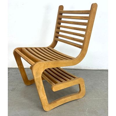Modernist Constructivist chair in birch plywood. Dimensions: Height: 34.5 inches, Width: 20 
