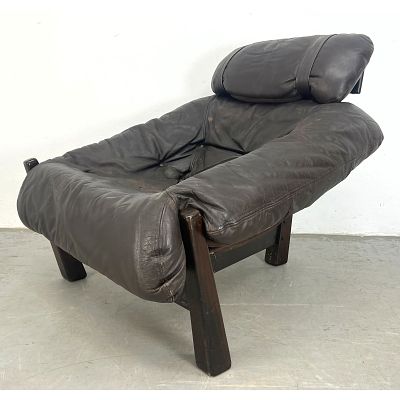 1970s Gerhard Van Den Berg Leather Lounge Chair. Slumped leather. Tripod base. sling seat. 