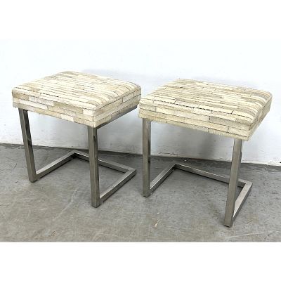 Pair cantilevered accent stools featuring square-profile polished metal frames. Dimensions: 
