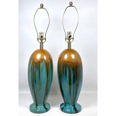 Pair Mid Century Modern Glazed Pottery Table Lamps. Dimensions: Height: 32 inches, Width: 6.5 