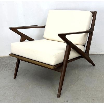 Poul Jensen Z Lounge Chair. Triangular Frame Arms. Dark Stained Wood. Dimensions: Height: 26 