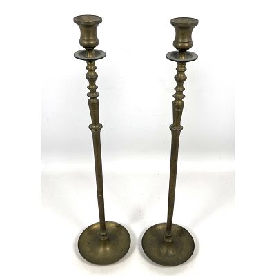 Pair of tall brass candlesticks designed in a traditional Neoclassical style. Solid brass. 
