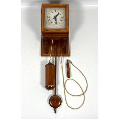Wall-mounted hooded clock featuring a mechanical wooden-works movement, attributed to artisan 